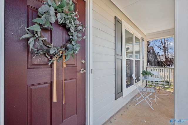 doorway to property with a porch