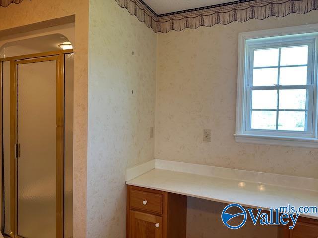 full bath featuring vanity and a stall shower