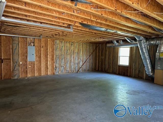 miscellaneous room featuring concrete flooring and electric panel