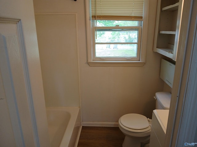 bathroom with hardwood / wood-style flooring, toilet, and vanity