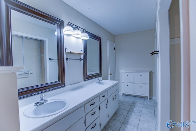 bathroom with vanity and tile patterned floors