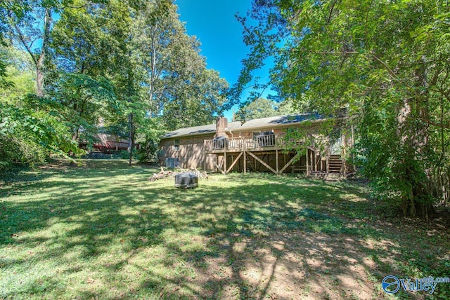 view of yard featuring a wooden deck