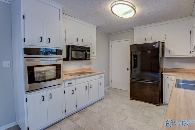 kitchen featuring white cabinets, a textured ceiling, and black appliances