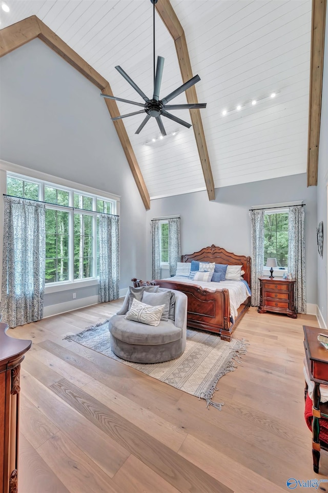 13559 Monte Vedra Rd SE, Huntsville, AL 35803 - bedroom with high vaulted ceiling, wood finished floors, multiple windows, beam ceiling, and a ceiling fan