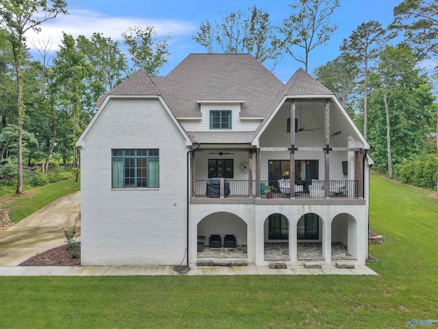 13559 Monte Vedra Rd SE, Huntsville, AL 35803 - rear view of house with a balcony, ceiling fan, a yard, a shingled roof, and a patio