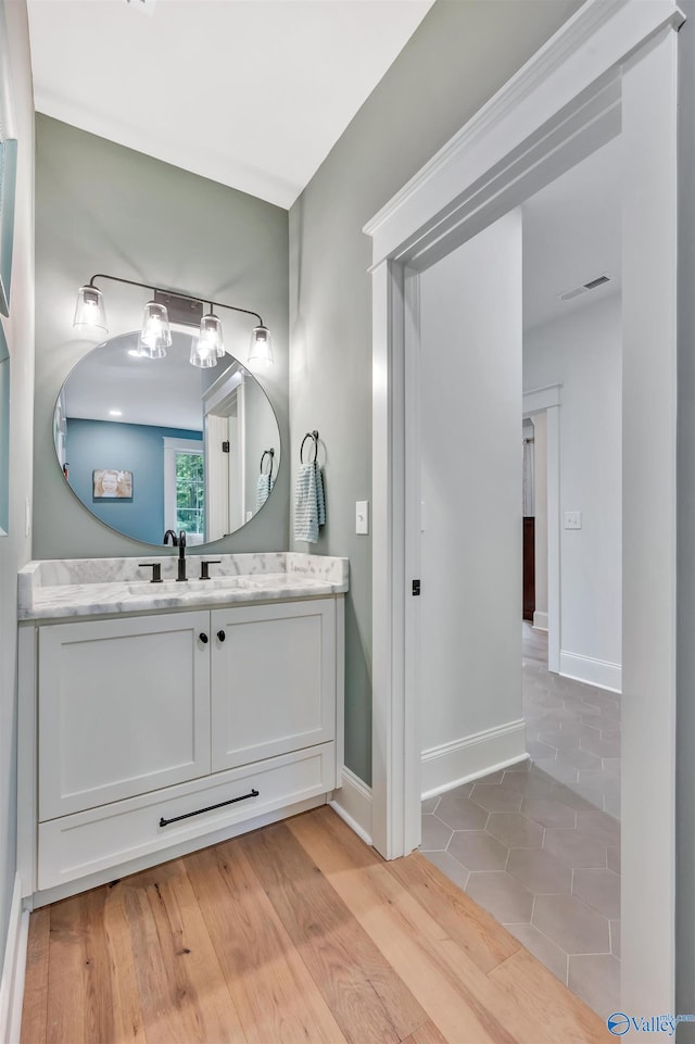 13559 Monte Vedra Rd SE, Huntsville, AL 35803 - bathroom featuring vanity and wood finished floors