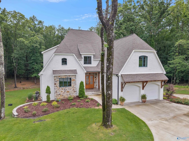 13559 Monte Vedra Rd SE, Huntsville, AL 35803 - view of front of property with stone siding, a front lawn, a garage, roof with shingles, and concrete driveway