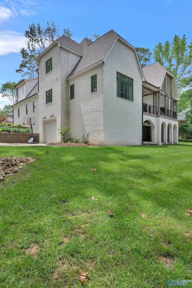 13559 Monte Vedra Rd SE, Huntsville, AL 35803 - view of side of property featuring a garage, a yard, a shingled roof, and stucco siding