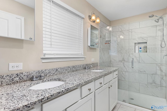 bathroom with vanity and walk in shower