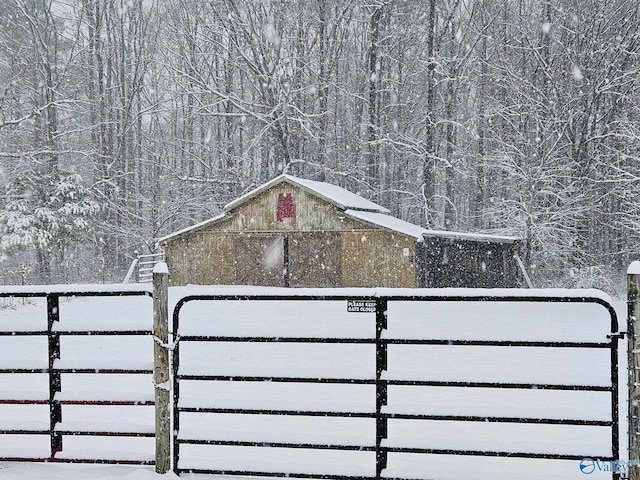 view of gate with fence