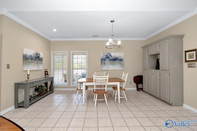 dining area with a chandelier, ornamental molding, light tile patterned flooring, and baseboards