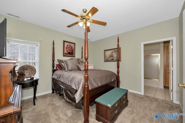 bedroom with light carpet, baseboards, visible vents, a ceiling fan, and a textured ceiling