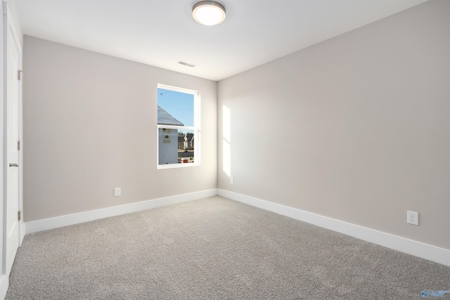 spare room featuring carpet floors