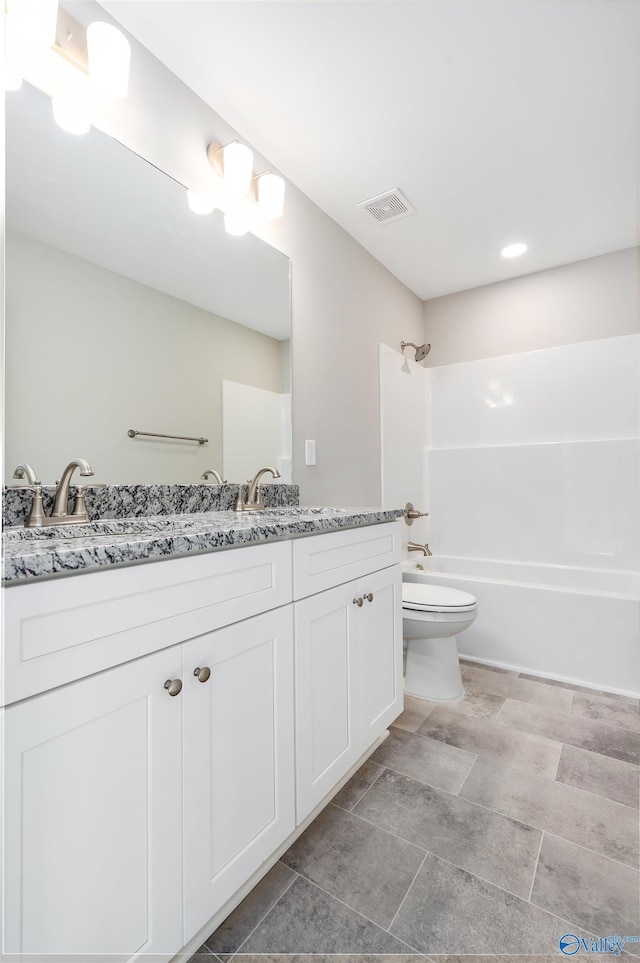 full bathroom with toilet, vanity, and bathtub / shower combination