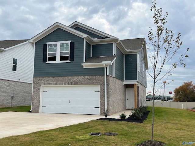 view of front of home featuring a garage and a front lawn