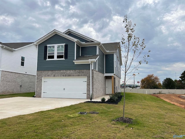 view of front of property featuring a garage and a front yard