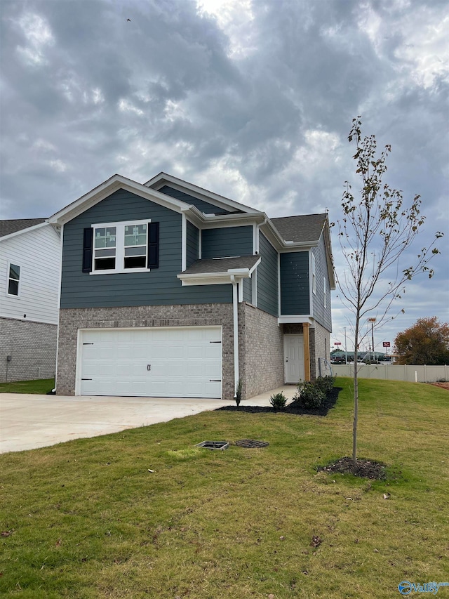 view of front facade with a garage and a front yard