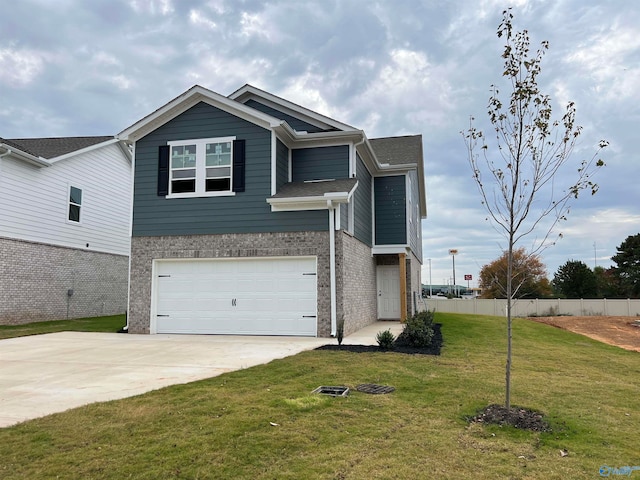 view of front of property featuring a garage and a front lawn