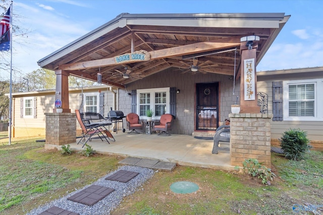 exterior space with ceiling fan