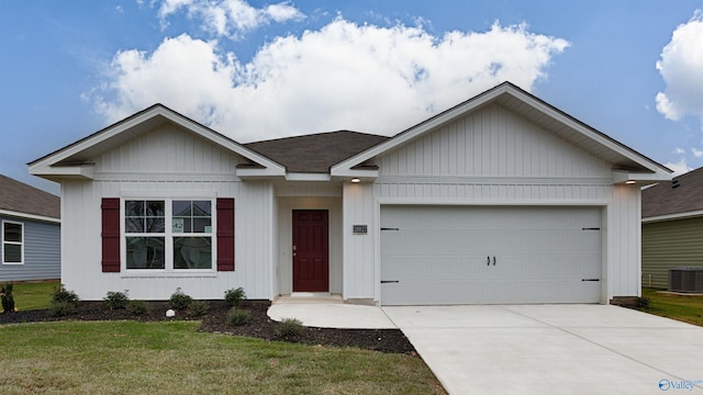 single story home featuring a garage, a front yard, and central air condition unit