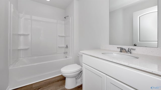 full bathroom with vanity, hardwood / wood-style flooring, bathtub / shower combination, and toilet