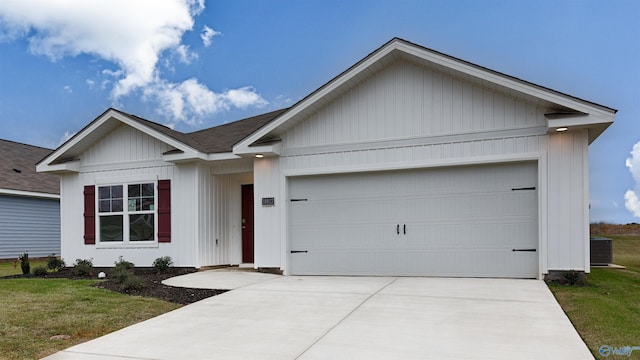 single story home featuring a garage, central AC unit, and a front yard