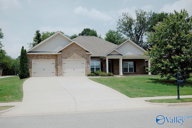 207 Somerton Dr, Huntsville, AL 35811 - craftsman-style home with a garage, brick siding, a front yard, and driveway