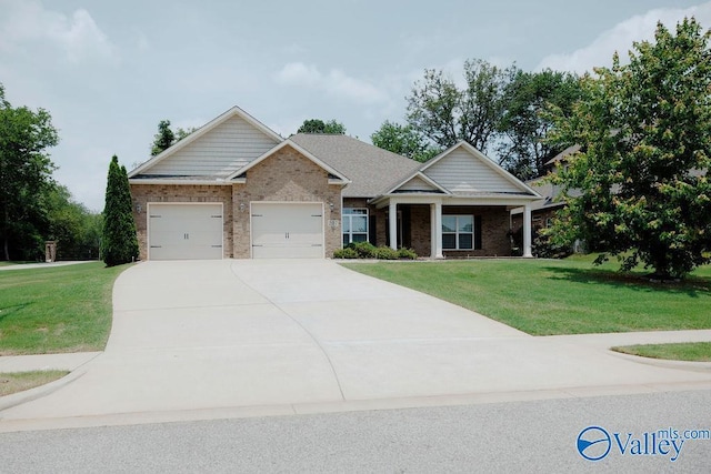 207 Somerton Dr, Huntsville, AL 35811 - craftsman inspired home with a garage, a front yard, concrete driveway, and brick siding