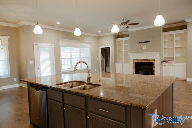 207 Somerton Dr, Huntsville, AL 35811 - kitchen with a sink, dishwasher, wood finished floors, healthy amount of natural light, and crown molding