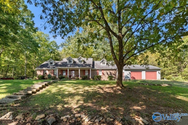 ranch-style home with a garage and a front lawn