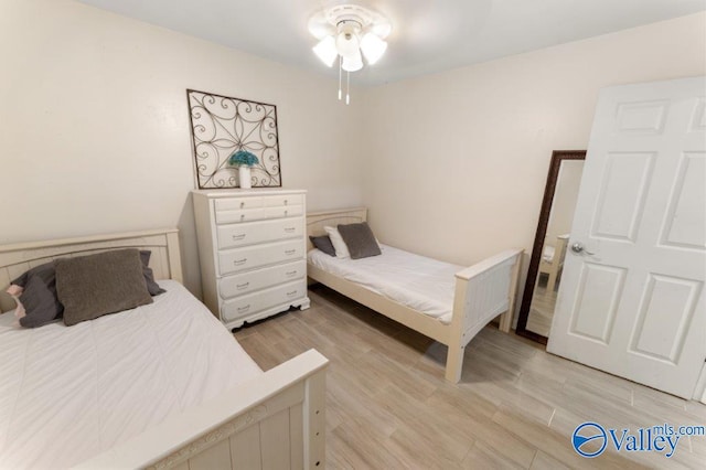 bedroom featuring light wood-style floors
