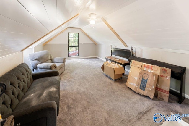 interior space with vaulted ceiling and carpet