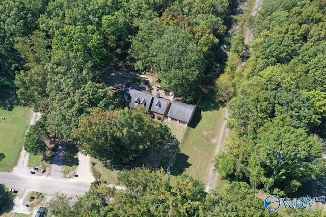 bird's eye view featuring a forest view