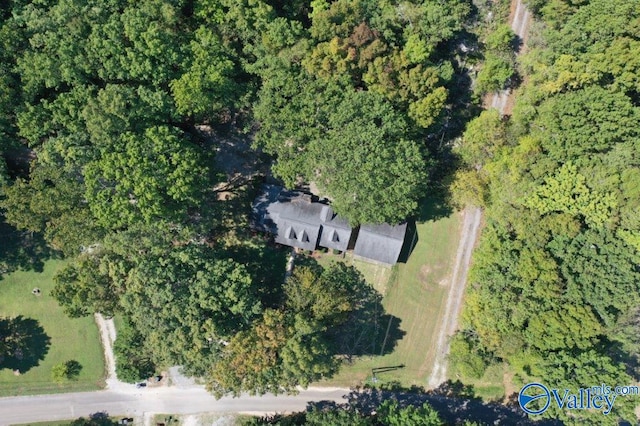 aerial view featuring a wooded view