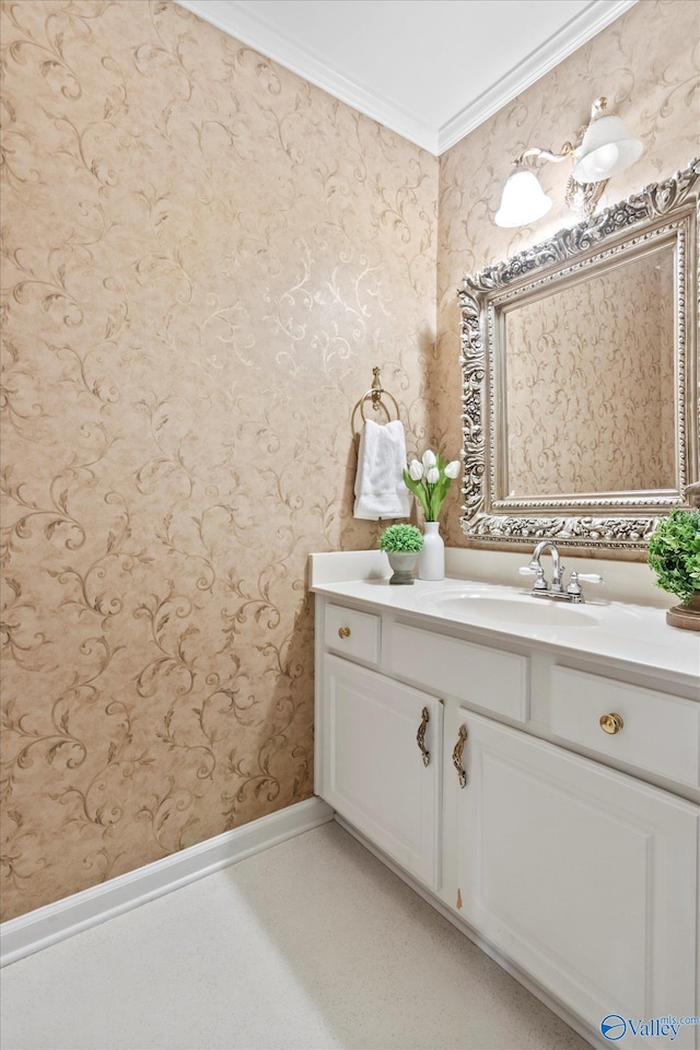 bathroom with crown molding, wallpapered walls, vanity, baseboards, and tile patterned floors