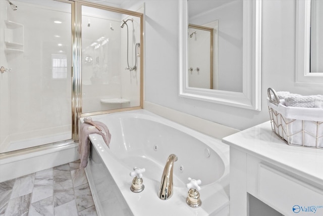 bathroom with marble finish floor, a shower stall, a tub with jets, and vanity