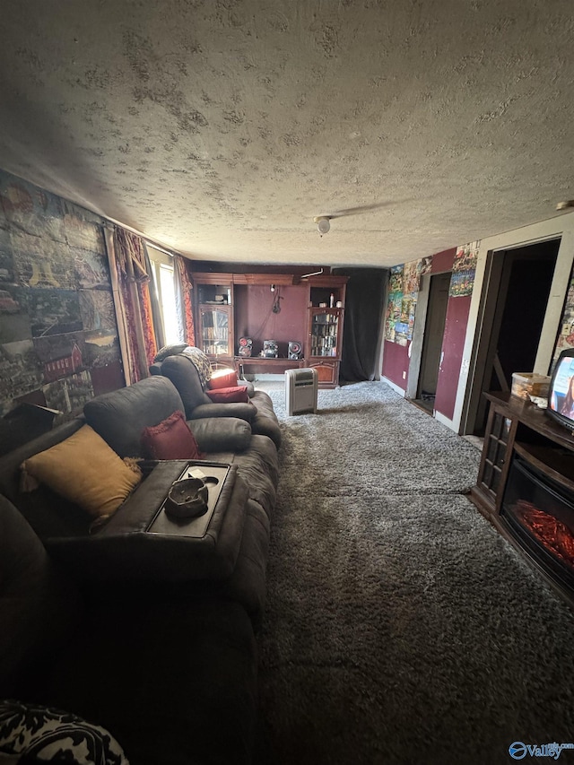 carpeted living area featuring a textured ceiling