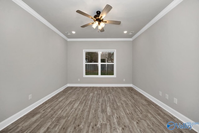 spare room featuring ceiling fan, ornamental molding, and hardwood / wood-style flooring