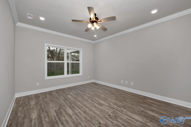 empty room with crown molding, dark hardwood / wood-style flooring, and ceiling fan