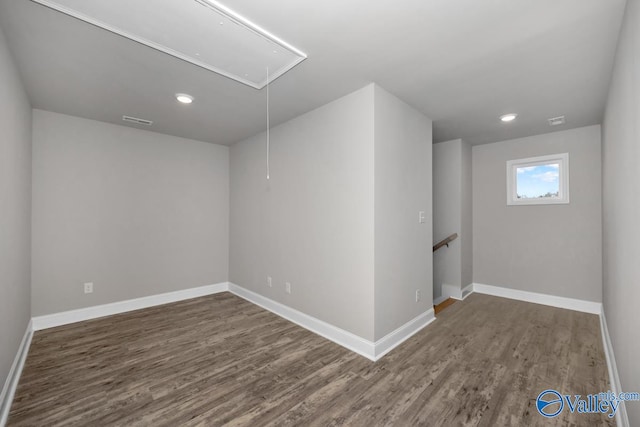 unfurnished room with dark wood-type flooring