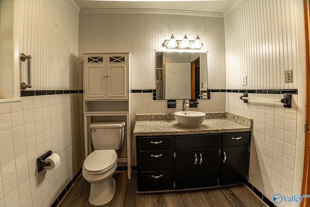 53 Price Mountain Dr, Decatur, AL 35603 - bathroom with tile walls, wood finished floors, ornamental molding, toilet, and vanity