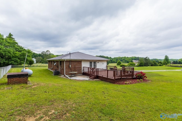 53 Price Mountain Dr, Decatur, AL 35603 - back of house featuring a deck, central air condition unit, a patio, and metal roof