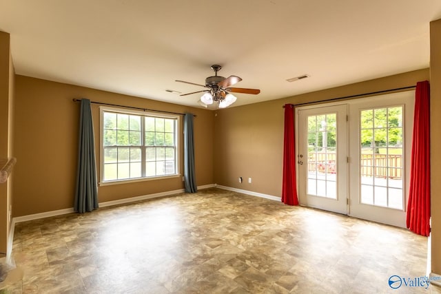 53 Price Mountain Dr, Decatur, AL 35603 - spare room with healthy amount of natural light, a ceiling fan, and baseboards