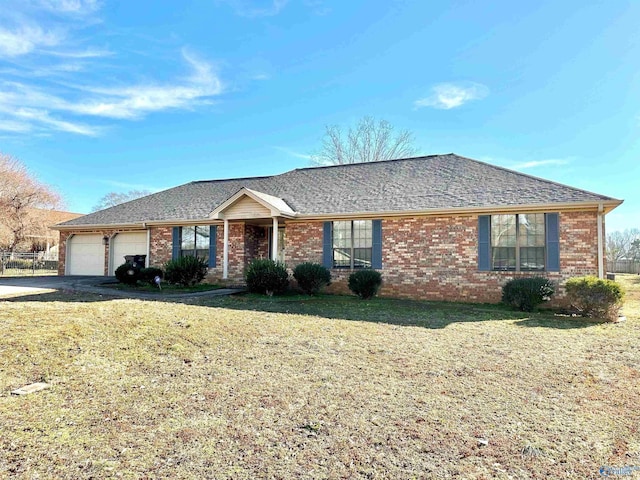 single story home featuring a garage and a front lawn