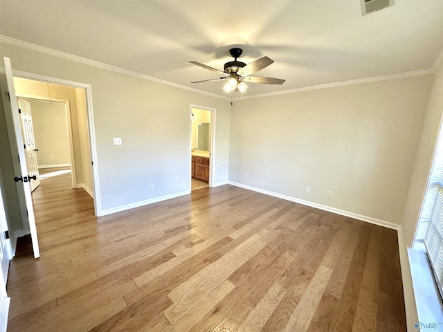 unfurnished bedroom featuring ceiling fan, ornamental molding, ensuite bathroom, and light hardwood / wood-style flooring