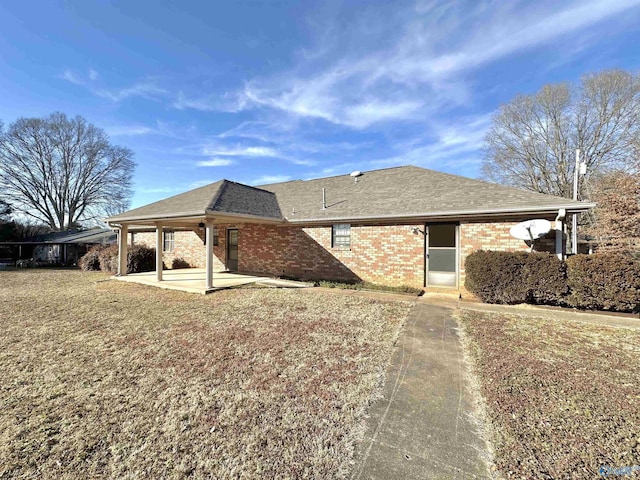 view of property exterior featuring a patio area and a lawn