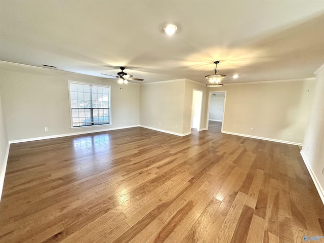 unfurnished room with crown molding, ceiling fan, and wood-type flooring