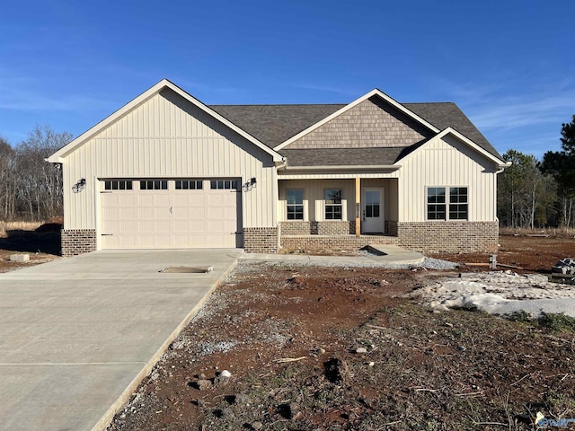 modern farmhouse with a porch and a garage