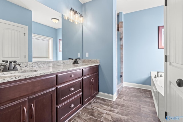 bathroom featuring shower with separate bathtub and vanity