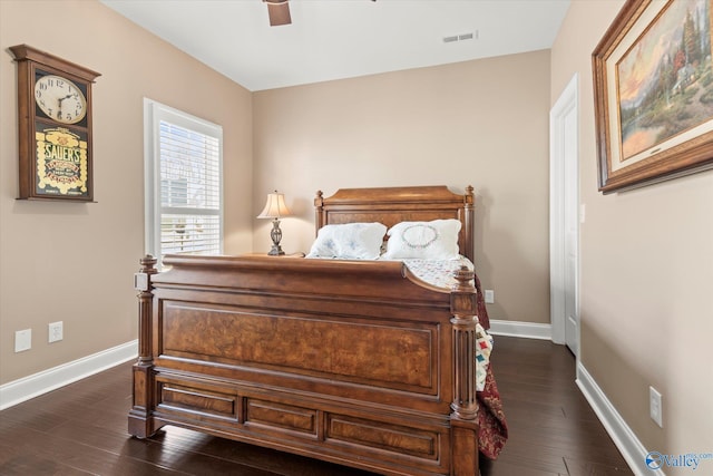 bedroom featuring ceiling fan and dark wood-type flooring